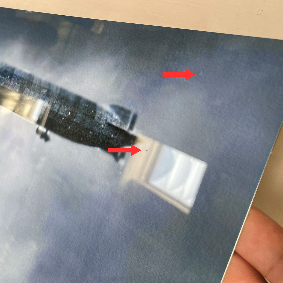 Very small bumps or dips on the surface of the print